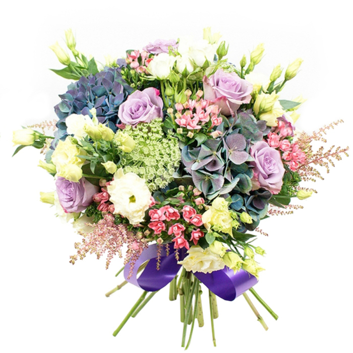 This elegant floral arrangement crafted with South Croydon's signature style displays a harmonious blend of rich purples, soft blues, gentle pinks, and fresh greens-each flower thoughtfully placed to evoke feelings of romance and celebration. Central to the bouquet, billowing hydrangeas in dusky indigo and teal mingle with large clusters of soft lavender roses, their layered petals unfurling gracefully. Creamy white ranunculus and classic white roses provide sculptural contrast, their plush, ruffled textures enhancing the bouquet's light and airy appeal. Vibrant sprays of fuchsia-pink and blush waxflowers thread throughout, accompanied by ethereal, feathery astilbe in delicate pink-contributing both height and gentle whimsy to the asymmetric design. Wispy lisianthus in pale yellow-green, some in closed buds, add brightness and vertical interest, echoing the fresh, early-morning energy near South Croydon's bustling High Street. Lacy clusters of Ammi Majus bring intricate detail to the centre, while selected dark green foliage offers natural depth, echoing the lushness of nearby gardens. Binding the arrangement is a wide royal purple satin ribbon, which glimmers subtly and unifies the palette with a sense of opulence. The bouquet, designed to stand out as a dramatic centrepiece or heartfelt gift, radiates with quiet elegance and expert craftsmanship, perfectly encapsulating the flourishing floral spirit found across South Croydon. Ideal for special moments-from joyous celebrations to personal milestones-it carries the fragrance and artistry of a cherished local florist.