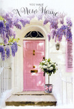 In this quietly enchanting doorway scene, a South Croydon home is dressed in soft pastels and gently tumbling blooms, as if the building itself is joining in a celebration. A pale pink front door, painted in a powdery, chalk-finish blush, forms the focal point, its simple panels catching faint streaks of sunlight that slant across from the left, much like the mellow afternoon light you might see near Wandle Park. Above the door, wisteria dangles in abundant strands of lavender and lilac, each flower cluster a delicately tapered curtain that frames the entrance with a dreamy, romantic air. The walls on either side are whitewashed, their subtle imperfections and texture lending character, while a single shutter, painted in matching blush tones, adds a sense of symmetry and gentle sophistication. On the doorstep itself sits a grey tin bucket, slightly weathered, its rounded sides cradling a full arrangement of creamy white roses. The roses are plush and layered, some fully open, others just beginning to unfurl, each surrounded by soft, silvery-green foliage that offers contrast and depth. Around the base of the bucket, a satin pink ribbon has been tied into a loose bow, its tails trailing gracefully across the stone, picking up the pastel palette of the door and flowers above. The whole image feels like the moment just before someone arrives home to this new address, perhaps after picking up keys from an estate agent on Brighton Road: the flowers waiting on the step like an embrace, breathing out scent, warmth, and the tender promise that this doorway will soon witness shared meals, laughter, and the steady, comforting rhythm of everyday life in South Croydon.
